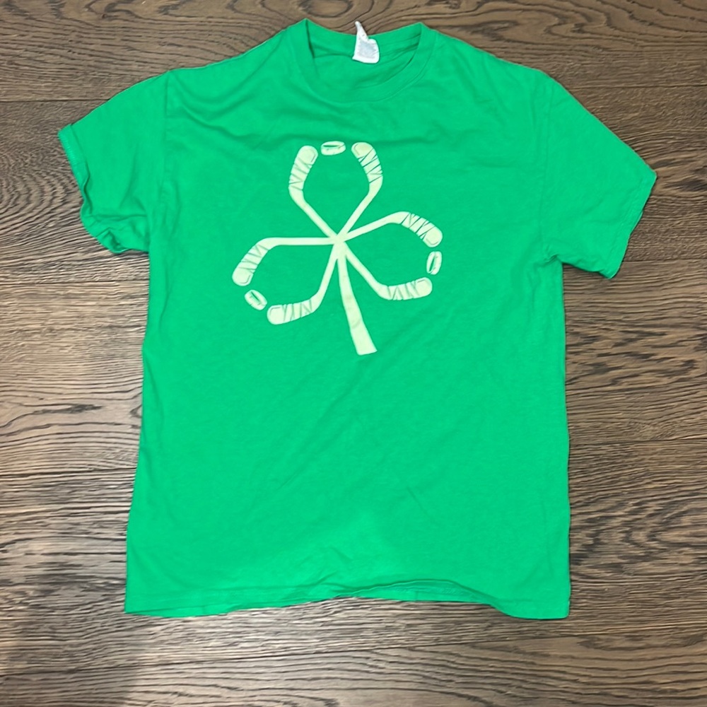 Green clover made of hockey stick shirt